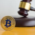 Bitcoin,And,Hammer,Judge,Gavel,On,Yellow,Table,With,White