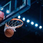 Basketball,scoring,a,basket,as,it,goes,through,the,hoop