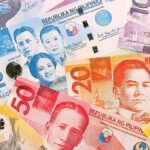 Philippines,Peso,Money,Bills,Pile,On,Table.,Philippines,Banknotes,Of